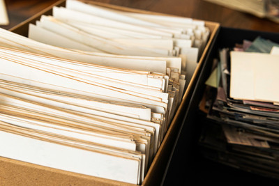 Stack of old photo prints and Memories to be digitized a